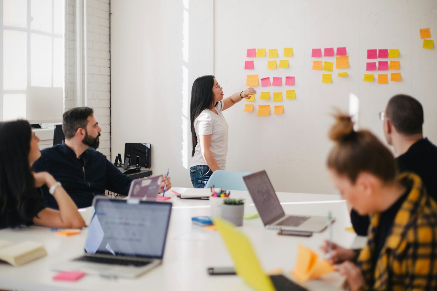 Stand-in photograph of people collaborating in a workshop. This is not the Instalogic team.